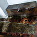 aldbury church,c13 coffin lid and c14 parish chest surrounded by c15 tiles in the north aisle