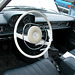 White steering wheel and old-style stick gear pole