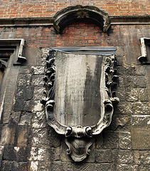 bow church, london,monument of 1763 to john cock?, collar maker to his majesty and his royalist father, on the outside of the south aisle , which was refaced in 1794