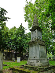 barking church, essex,early c18 monument to the north of the church, an obelisk of putti and skulls