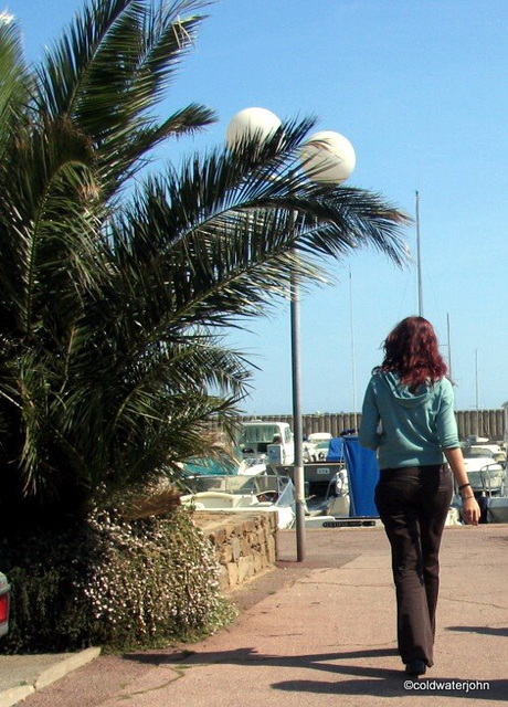 St Tropez Summer Girl strolling by the harbour