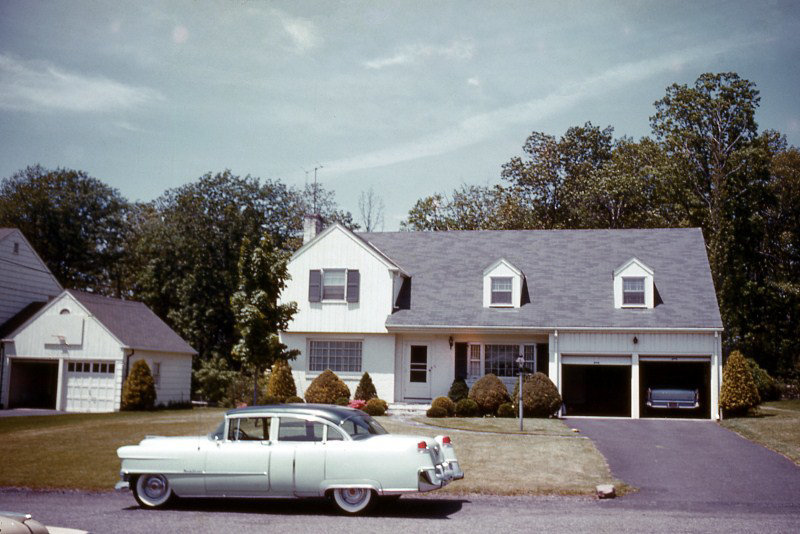 Car in Front of a Two-Garage House