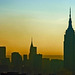Manhattan skyline at dawn from above the Hudson river.