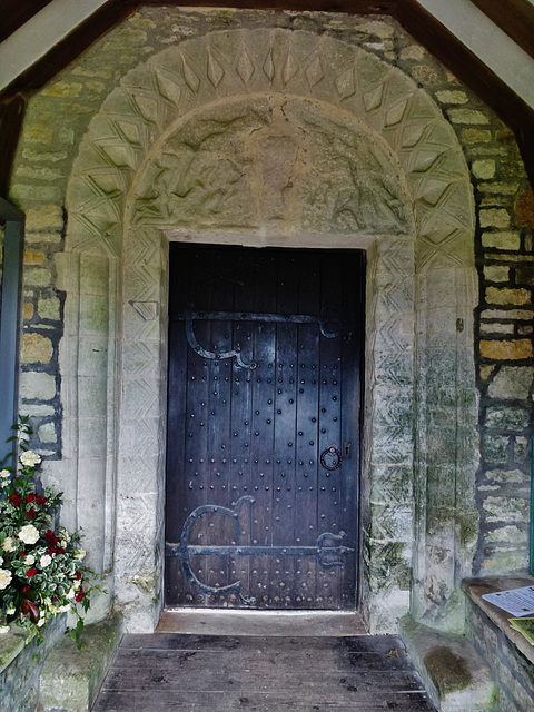 worth matravers church, dorset,the south doorway with its tympanum is supposed to be an import, but I can't imagine anyone doing such a thing in the c16 or at any time until antiquarians came into the