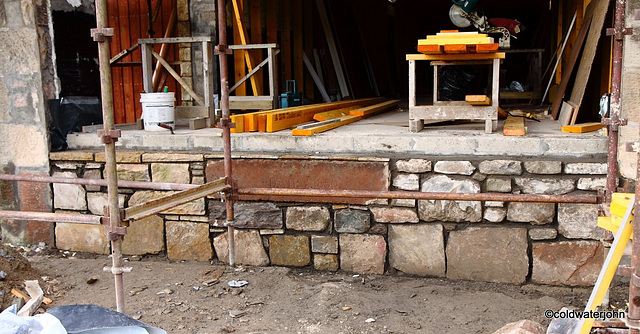 Completed stone facework below south-facing window including the old stone door lintel, inscribed "Dairy 1850" Completed stone facework below south-facing window including the old stone door lintel, inscribed "Dairy 1850"