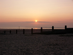 Sunset over a groyne, West Wittering