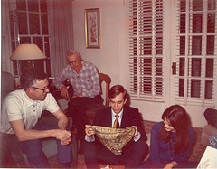Having some fun with the new guy. "Gee, thanks, it's the lovliest one I've ever seen.  What is it?"  Horton, Grandpa Parkes, Rick and Mary. Christmas 1969