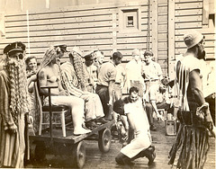 Officers and men of the USS Catamount particiapte in a Crossing the Line ceremony marking the crossing of the Equator.  Spring, 1945 in the Pacific