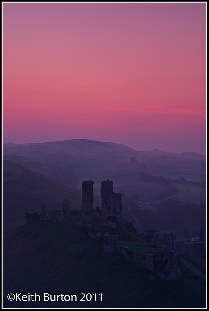 Castle in the mist at sunrise