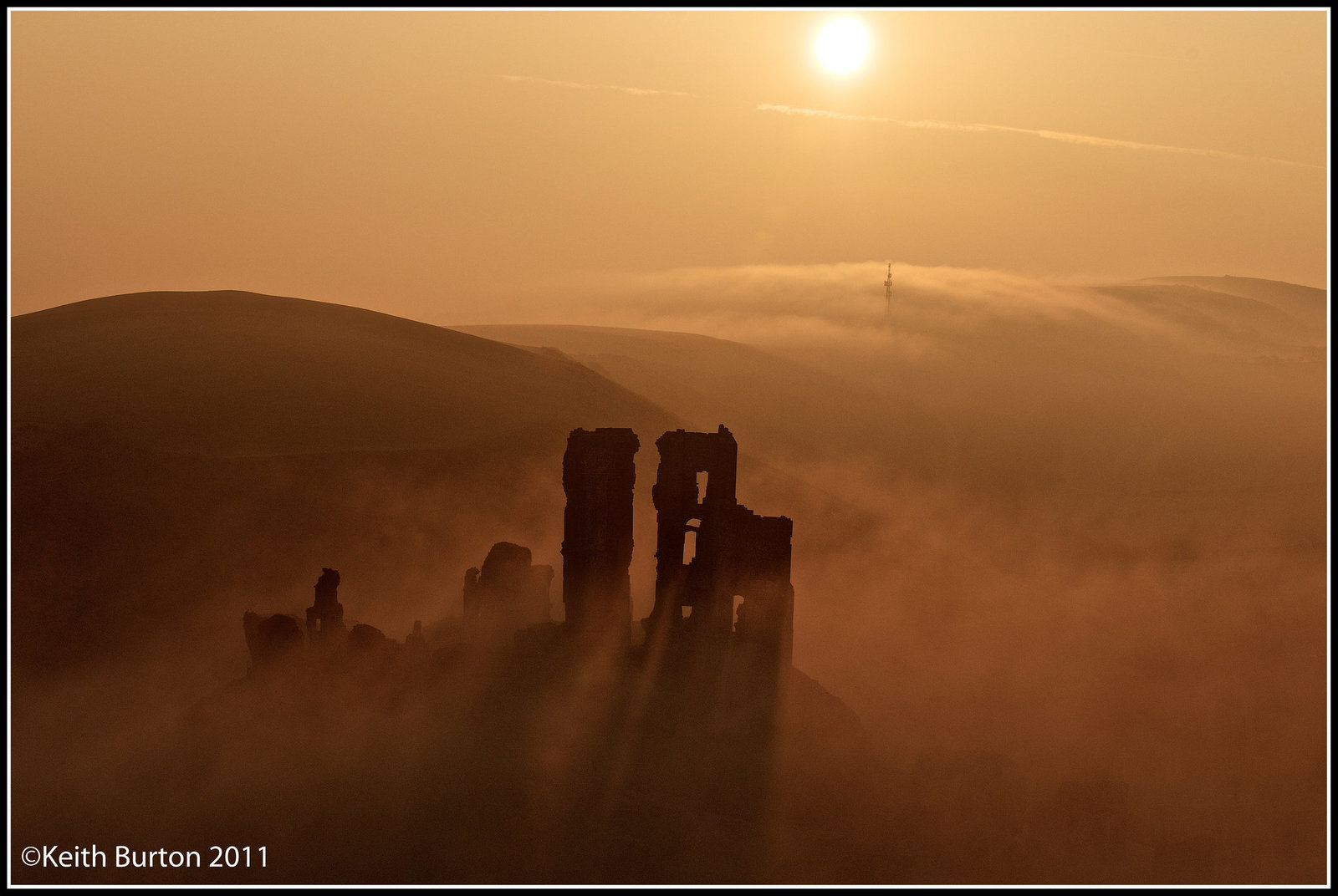 Castle in the mist at sunrise