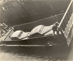 A landing craft in the flooded bay of the USS Catamount, LSD 17, preparing to ferry vehicles to port.  Spring, 1945 in the Pacific