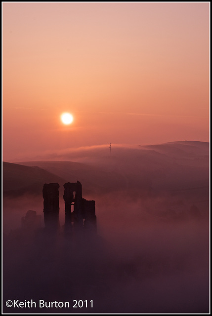 Castle in the mist at sunrise