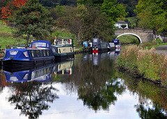 Canal, boats and reflections.