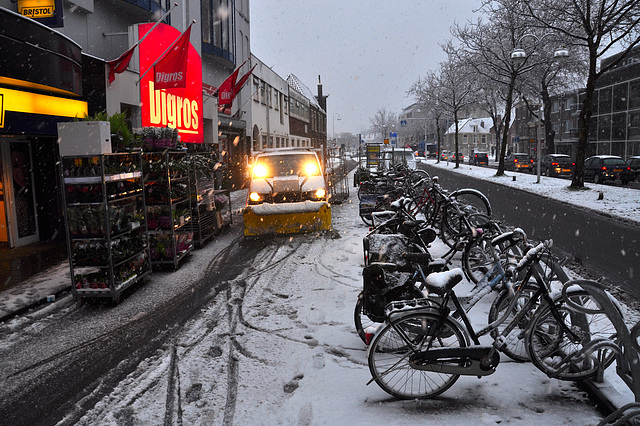 Snow plough clearing the bicycle path