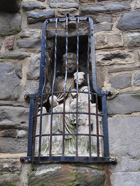 Madonna and Child behind bars