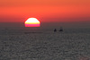 Two barges, one sunset