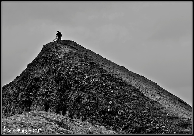 Getting the shot...........overlooking the sea and rocks along the Hartland Peninsula