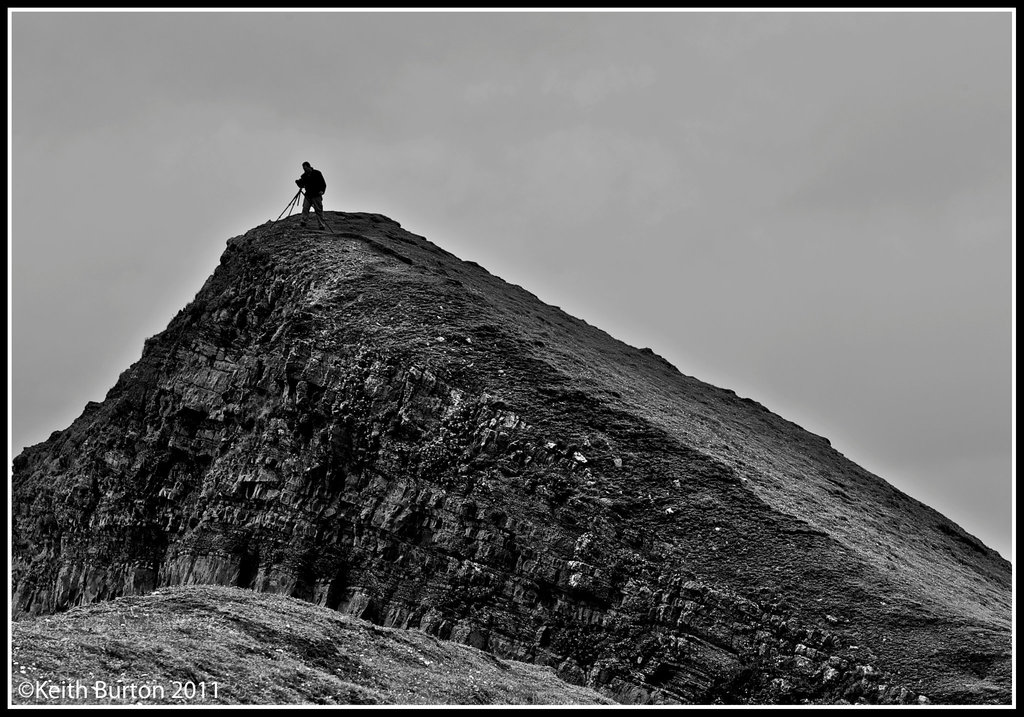 Getting the shot...........overlooking the sea and rocks along the Hartland Peninsula