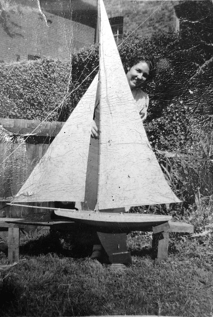 Mum pre 1939 with green hull yacht made by granddad trimmed