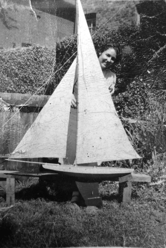 Mum pre 1939 with green hull yacht made by granddad trimmed