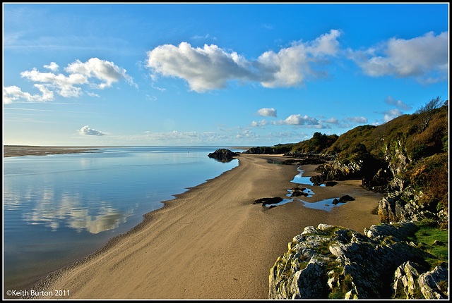 Beach view with cloud reflections