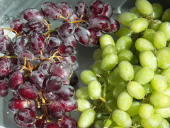 Red and Green Grapes Under Water