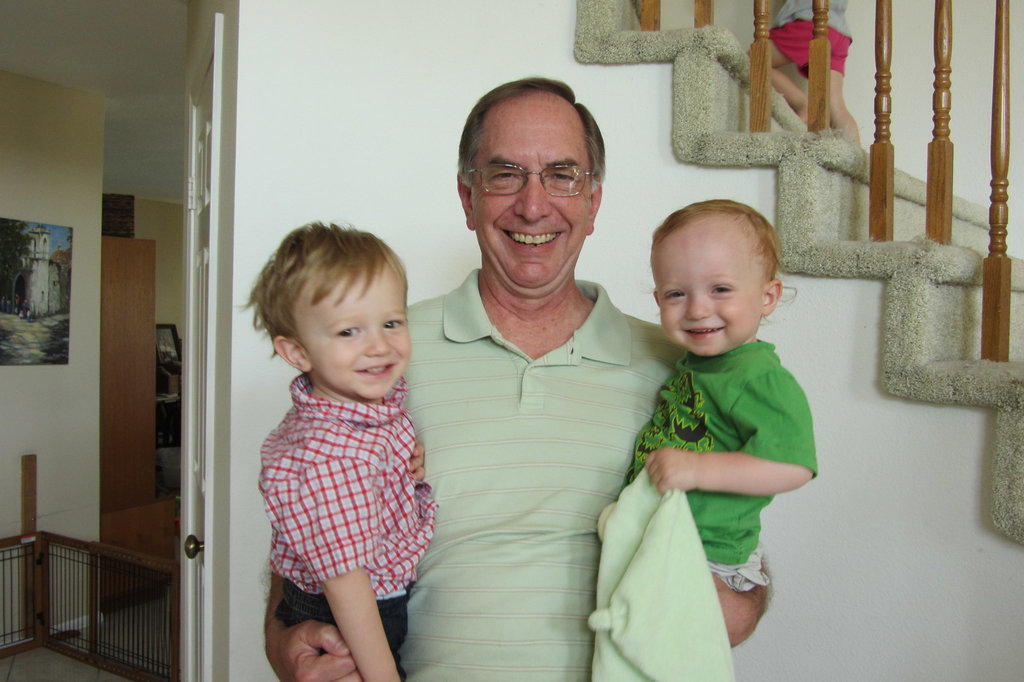 Cousins and a portly papa sharing a laugh  They both turned two this week.