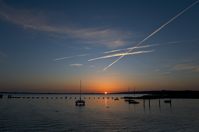 Sunset and vapour trails