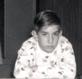 Serious young man in Christmas pajamas