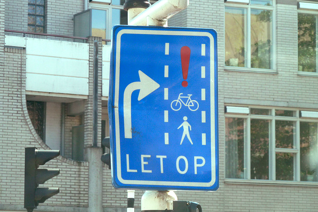 Watch out for people, bicycles and giant red exclamation marks