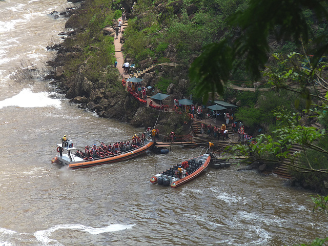 Adventurous Tourists Preparing for a Soaking