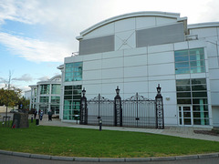 The front of the new building with the old Queen's Road gates.