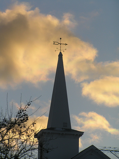 Against the clouds.