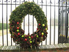 Wreath with fruit and pine cones
