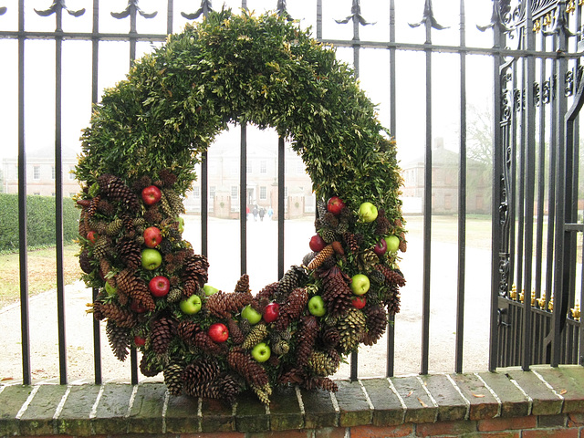 Wreath with fruit and pine cones