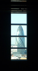 a gherkin view down a long unlit corridor