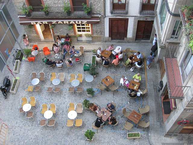 Two sidewalk cafes in Jaca. Seen from the hotel-room.