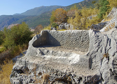 seat carved into the rocky outcrop, above the amphitheatre