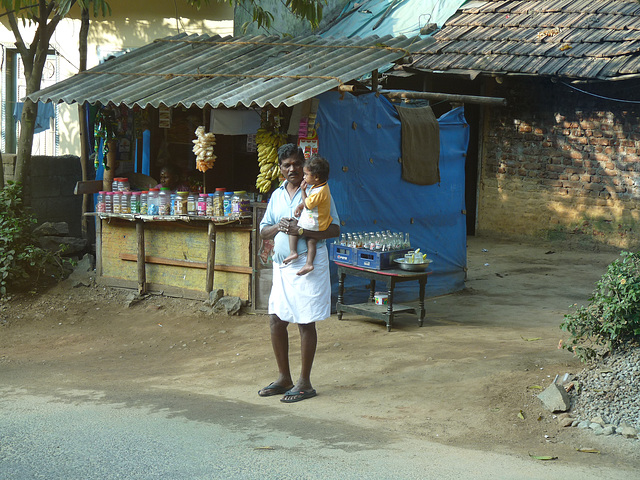 Father and Child by the Sweetshop