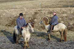 fuzzy photo of two riders on fuzzy horses