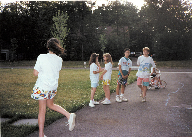 Neighborhood kids on the driveway admiring my crop of clover, 1988