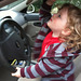 Kolton practices driving Papa's car