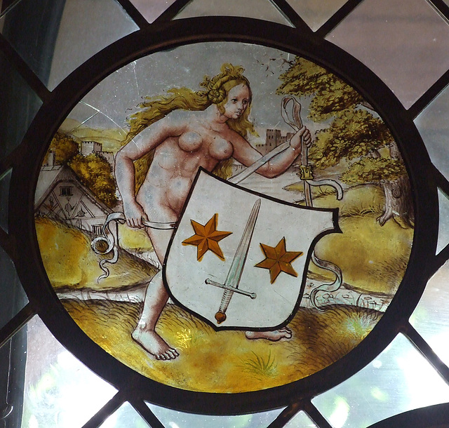 Nude Woman Supporting a Heraldic Shield Stained Glass Roundel in the Cloisters, June 2011