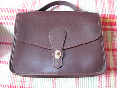 Brown leather purse, before