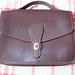 Brown leather purse, before