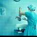 Labor and delivery nurse at work in the hospital birthing room, where the real labor has just concluded.