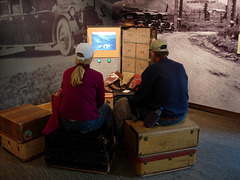 Viewing a film on park history at the visitors center