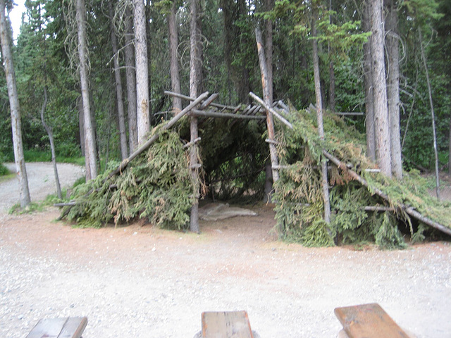 Native lean-to with opening in the middle for a fire