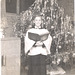 Karen, Christmas, 1957.  Practicing for children's choir.