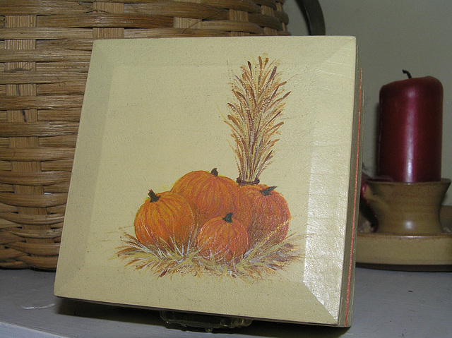 pumpkins on small wooden box